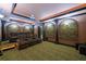 Spacious media room featuring comfortable seating, a large screen, and custom columns for a theater experience at 50 S Underwood Dr, Covington, GA 30016