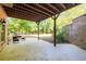 Open patio area beneath the deck, complete with outdoor seating and shade at 50 S Underwood Dr, Covington, GA 30016