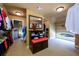 Large walk-in closet with a window, bench, and plenty of space for storage at 50 S Underwood Dr, Covington, GA 30016