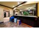 View of the wet bar opening into a large living space that is great for entertaining guests at 50 S Underwood Dr, Covington, GA 30016