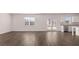 Large open floor plan with luxury floors connecting the living room and kitchen at 632 Kimberwick Dr, Locust Grove, GA 30248