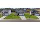 Street view featuring multiple new-construction homes and well-manicured lawns at 632 Kimberwick Dr, Locust Grove, GA 30248