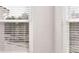 Close up view of window with white blinds at 632 Kimberwick Dr, Locust Grove, GA 30248
