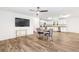 Open concept living space featuring an eat-in kitchen with stainless appliances and sleek white cabinets at 8405 Military Way, Douglasville, GA 30134