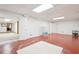 Finished basement with a large open space, neutral paint color, and access to other areas of the home at 918 Guinevere Way, Lilburn, GA 30047