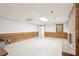 Basement featuring a brick fireplace, paneled walls, and a separate entrance to the exterior at 918 Guinevere Way, Lilburn, GA 30047