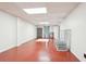 Finished basement with a large open space, and neutral paint color; perfect for entertaining or relaxing at 918 Guinevere Way, Lilburn, GA 30047