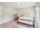 Comfortable bedroom featuring soft natural light, neutral walls, carpet, and rocking chair at 918 Guinevere Way, Lilburn, GA 30047