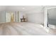 Large carpeted bonus room with a sloped ceiling and vintage furniture on display at 918 Guinevere Way, Lilburn, GA 30047