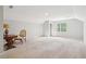 Bright bonus room features neutral walls, carpet, a window, and space for flexible living at 918 Guinevere Way, Lilburn, GA 30047