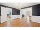 Formal dining room features hardwood floors and an open layout connected to the kitchen at 918 Guinevere Way, Lilburn, GA 30047