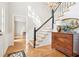 Bright foyer showcases hardwood floors and an elegant staircase with a chandelier at 918 Guinevere Way, Lilburn, GA 30047