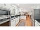 Kitchen with stainless steel appliances and dark countertops at 918 Guinevere Way, Lilburn, GA 30047