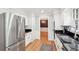 Updated kitchen featuring stainless steel appliances and dark countertops at 918 Guinevere Way, Lilburn, GA 30047