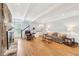 Bright living room features hardwood floors, a stone fireplace, and a floral couch at 918 Guinevere Way, Lilburn, GA 30047