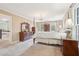 Spacious main bedroom featuring a four-poster bed, neutral walls, and ample natural light at 918 Guinevere Way, Lilburn, GA 30047