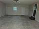 Empty living room with walls ready for paint, offering renovation potential at , Stockbridge, GA 30281