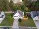 Aerial view of home with fenced yard, lush greenery, and neighborhood at 1389 Shadow Creek Ave, Hampton, GA 30228