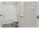 Bright bathroom featuring a tub, granite vanity, neutral walls, and tile flooring at 1389 Shadow Creek Ave, Hampton, GA 30228