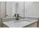 Bathroom featuring a granite countertop, updated faucet and fixtures, and a bright mirror at 1389 Shadow Creek Ave, Hampton, GA 30228