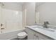 Bathroom showcases a bathtub, commode, granite countertops, and brushed nickel finishes at 1389 Shadow Creek Ave, Hampton, GA 30228