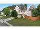 Well-maintained two-story home featuring a fenced yard and established landscaping at 1389 Shadow Creek Ave, Hampton, GA 30228