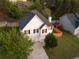 Two-story home with great curb appeal, featuring manicured landscaping and a charming fence at 1389 Shadow Creek Ave, Hampton, GA 30228
