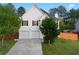 Charming two-story home with a two-car garage and well-manicured front lawn at 1389 Shadow Creek Ave, Hampton, GA 30228