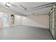Garage area showing water heater, utility hookups, epoxy flooring, and automatic door at 1389 Shadow Creek Ave, Hampton, GA 30228