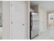 View of the kitchen with a stainless steel refrigerator at 1389 Shadow Creek Ave, Hampton, GA 30228
