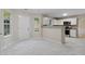 Bright living room features a kitchen, lots of light, and a nice view at 1389 Shadow Creek Ave, Hampton, GA 30228