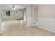Bright living room and dining area featuring tile floors, and plenty of natural light at 1389 Shadow Creek Ave, Hampton, GA 30228