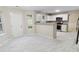 Spacious living room features a kitchen, lots of light, and a nice view at 1389 Shadow Creek Ave, Hampton, GA 30228