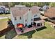 Expansive backyard featuring a covered patio, grill area, seating, and lush lawn for outdoor enjoyment at 209 Crestmont Way, Canton, GA 30114