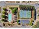 Aerial view of community amenities featuring pool, tennis courts and playground with parking at 209 Crestmont Way, Canton, GA 30114