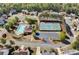 Aerial view of community pool, clubhouse, tennis courts, playground and surrounding homes at 209 Crestmont Way, Canton, GA 30114