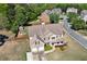 Two-story brick home with a large backyard, patio, fire pit, and shed at 209 Crestmont Way, Canton, GA 30114