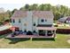 Aerial view of backyard featuring a patio and covered porch at 209 Crestmont Way, Canton, GA 30114