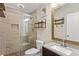 Bathroom with decorative shelves, a glass shower door, and tile flooring at 209 Crestmont Way, Canton, GA 30114