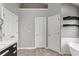Bathroom featuring a white vanity with dark wood drawers and 3 white doors at 209 Crestmont Way, Canton, GA 30114
