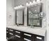 Bathroom boasting dual sinks, modern fixtures, and a glass-enclosed shower at 209 Crestmont Way, Canton, GA 30114