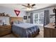 This bedroom offers a large window and a queen sized bed with side tables at 209 Crestmont Way, Canton, GA 30114