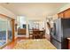 Open concept kitchen with granite counters, stainless steel appliances, and breakfast area at 209 Crestmont Way, Canton, GA 30114