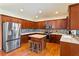 Modern kitchen with updated backsplash, countertops, and stainless steel refrigerator at 209 Crestmont Way, Canton, GA 30114