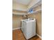 Well-organized laundry room featuring modern appliances and ample shelving at 209 Crestmont Way, Canton, GA 30114