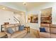 Inviting living room showcasing views into a connecting dining and kitchen area at 209 Crestmont Way, Canton, GA 30114