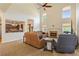 Comfortable living room with fireplace, large windows, and view of kitchen at 209 Crestmont Way, Canton, GA 30114