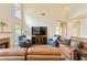 Bright living room with high ceilings, fireplace, and comfortable leather sofas at 209 Crestmont Way, Canton, GA 30114