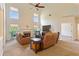 Bright living room with high ceilings, large windows, and a fireplace at 209 Crestmont Way, Canton, GA 30114