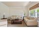 Inviting living room with neutral tones, comfortable seating, and a view of the outdoors at 209 Crestmont Way, Canton, GA 30114